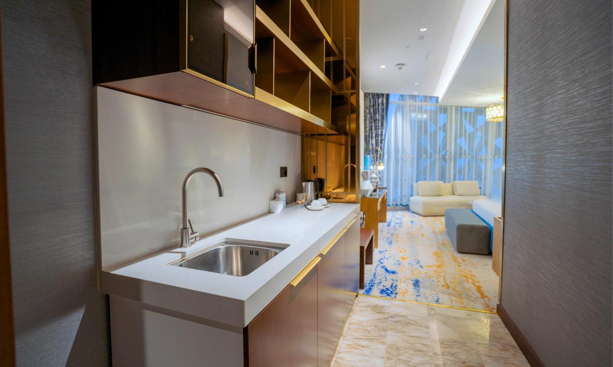 Velero Hotel Doha Lusail Экстерьер фото A kitchen in a hotel suite